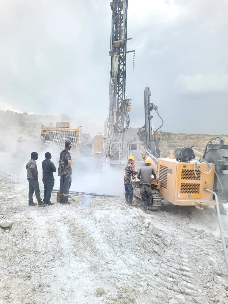 Site team working around active drilling equipment